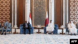 Qatar's Amiri Diwan shows Qatar's Emir Sheikh Tamim bin Hamad al-Thani meets Sudan's army chief Gen. Abdel Fattah al-Burhan in Doha, Sept. 7, 2023.