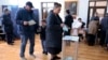 FILE - People vote at a polling station during the first round of presidential elections in Sukhumi, Georgia's breakaway region of Abkhazia, Feb. 15, 2025.