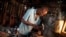 Guitar luthier Misoko Nzalayala Jean-Luther, alias Socklo, 61, works at his workshop in Kinshasa, Democratic Republic of Congo, Oct.18, 2021.