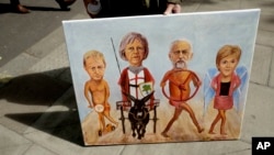 Artist Kaya Mar's painting marks the start of the British election campaign race in central London, April 26, 2017. Pictured are (from left) Liberal Democrats party leader Tim Farron, British Prime Minister and Conservative party leader Theresa May, leader of opposition Labour party Jeremy Corbyn and First Minister of Scotland and leader of the Scottish National Party Nicola Sturgeon.