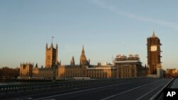 An almost empty Westminster Bridge normally a very busy river crossing as the sun rises in London, March 24, 2020.