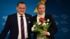 Alice Weidel, co-leader of Germany's far-right Alternative for Germany (AfD) party, holds a bouquet of flowers she was given by party co-leader Tino Chrupalla during a press conference on Dec. 7, 2024 in Berlin,