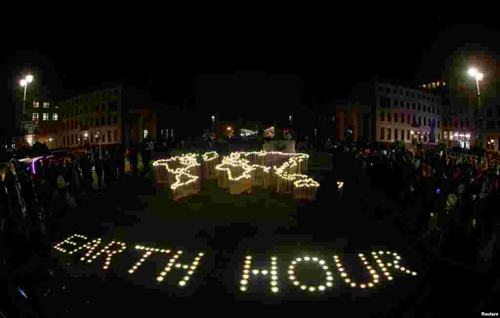 The Brandenburg Gate is pictured during Earth Hour in Berlin, March 30, 2019. Picture taken with fish-eye lens.