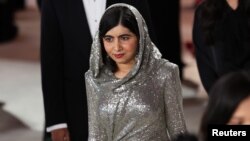 Malala Yousafzai walks the champagne-colored red carpet during the Oscars arrivals at the 95th Academy Awards in Hollywood, Los Angeles, California, March 12, 2023.