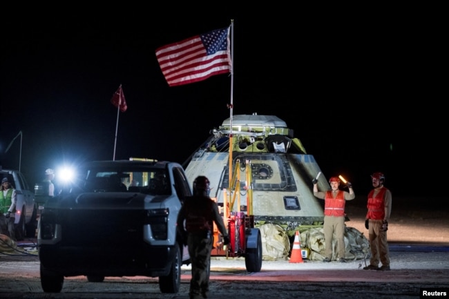 FILE - Boeing and NASA teams work around NASA's Boeing Crew Flight Test Starliner spacecraft after it landed uncrewed, at White Sands, New Mexico, U.S., September 6, 2024. (NASA/Aubrey Gemignani/Handout via REUTERS)