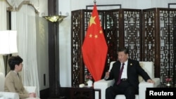 Chinese President Xi Jinping meets Chief Executive of Hong Kong Special Administrative Region (HKSAR) Carrie Lam, who is in Shanghai for the second China International Import Expo (CIIE), in Shanghai, China, Nov. 4, 2019.