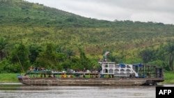 FILE —A general view of a wooden whaleboat on the Congo River, Democratic Republic of the Congo, on March 31, 2024.