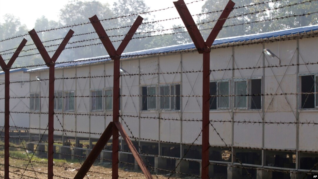 FILE - Newly-built repatriation camps prepared for Rohingya refugees expected to return from Bangladesh are surrounded by barbed-wire, Jan. 24, 2018, in Taungpyo township, border town of northern Rakhine State, Myanmar.