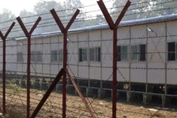 FILE - Newly built repatriation camps prepared for Rohingya refugees expected to return from Bangladesh are surrounded by barbed-wire, Jan. 24, 2018, in Taungpyo township, border town of northern Rakhine State, Myanmar.