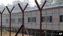 FILE - Newly-built repatriation camps prepared for Rohingya refugees expected to return from Bangladesh are surrounded by barbed-wire, Jan. 24, 2018, in Taungpyo township, border town of northern Rakhine State, Myanmar.