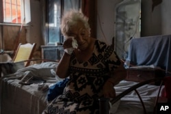 In this file photo, Margarita Salazar, 82, wipes the sweat off with a tissue inside her home in Veracruz, Mexico on June 16, 2024. (AP Photo/Felix Marquez, File)