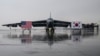 FILE - National flags of the United States and South Korea are displayed in front of a B-52H strategic bomber parked at a South Korean Air Force base at Cheongju Airport on October 19, 2023.