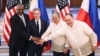 From left, U.S. Defense Secretary Lloyd Austin, Secretary of State Antony Blinken, Philippine Foreign Secretary Enrique Manalo and National Defense Secretary Gilberto Teodoro pose for the press at Camp Aguinaldo in Manila, Philippines, July 30, 2024.