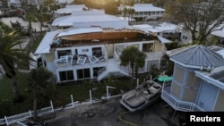 A drone view shows buildings and other structures damaged by Hurricane Milton after it made landfall, in Venice, Florida, Oct. 10, 2024.