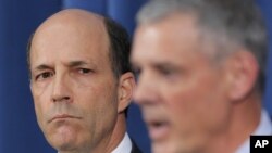 Commander of U.S. Forces in Japan Lt. Gen. Salvatore Angelella, right, speaks to the media as U.S. Ambassador to Japan John Roos looks on at the U.S. Embassy in Tokyo, October 19, 2012. 