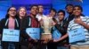 Co-champions of the 2019 Scripps National Spelling Bee, from left, Shruthika Padhy, Erin Howard, Rishik Gandhasri, Christopher Serrao, Saketh Sundar, Sohum Sukhatankar, Rohan Raja and Abhijay Kodali hold the trophy in Oxon Hill, Md., May 31, 2019.