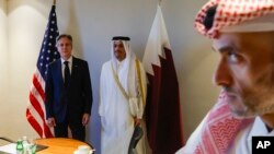 U.S. Secretary of State Antony Blinken, left, meets with Qatari Prime Minister Sheikh Mohammed bin Abdulrahman bin Jassim Al-Thani, second left, at a hotel during a day of meetings amid the ongoing conflict between Israel and Hamas, in Amman, Jordan, on Nov. 4, 2023.
