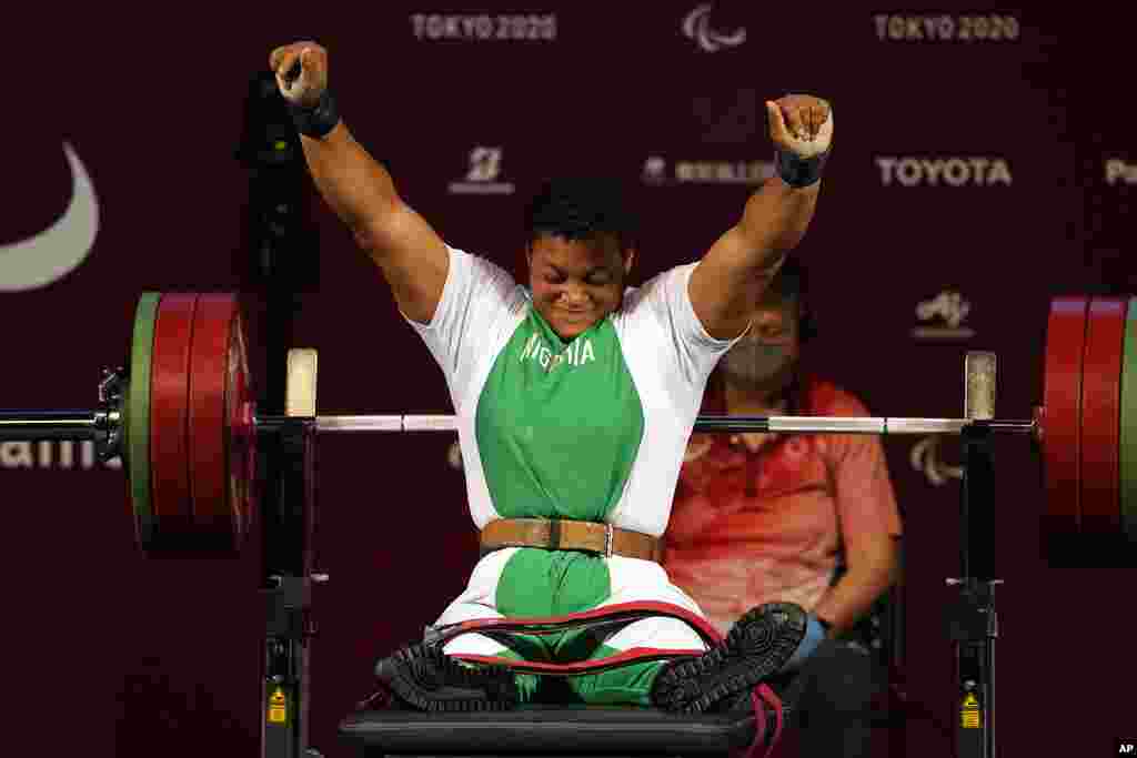 Nigeria&#39;s Folashade Oluwafemiato celebrates after winning a gold medal in women&#39;s -86kg powerlifting final at the Tokyo 2020 Paralympic Games, in Tokyo, Japan. (AP Photo/Kiichiro Sato)