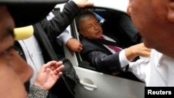 Mexico's President-elect Andres Manuel Lopez Obrador gestures as he leaves a meeting with the new members the Senate and lawmakers of his party MORENA in Mexico City, July 11, 2018. 