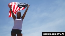 Athletic woman with a US flag