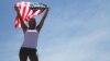 Athletic woman with a US flag