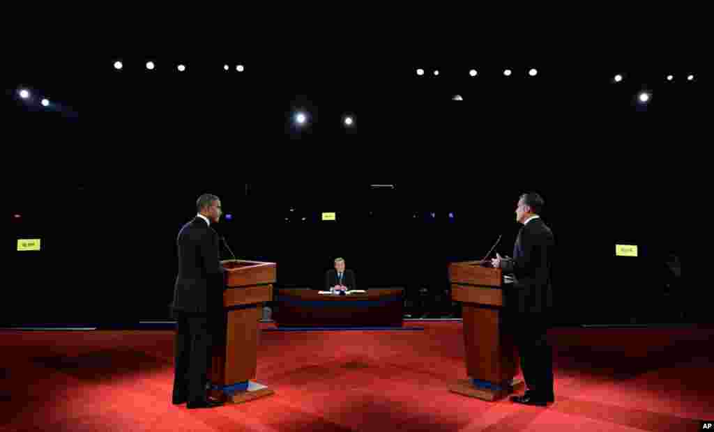 Barack Obama and Mitt Romney at the first presidential debate at the University of Denver, moderated by Jim Lehrer of PBS.