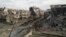 Damaged buildings and debris are pictured in the besieged area of Homs, Syria, Dec. 24, 2013. 