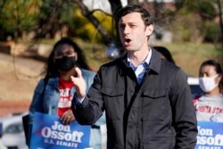 FILE - Democratic candidate for the U.S. Senate from Georgia Jon Ossoff speaks after voting early in Atlanta, Dec. 22, 2020.