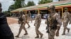 FILE - The leader of Mali's ruling junta, Colonel Assimi Goita, center, attends an Independence Day military parade in Bamako, Mali, on Sept. 22, 2022.