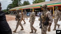 FILE - The leader of Mali's ruling junta, Colonel Assimi Goita, center, attends an Independence Day military parade in Bamako, Mali, on Sept. 22, 2022.