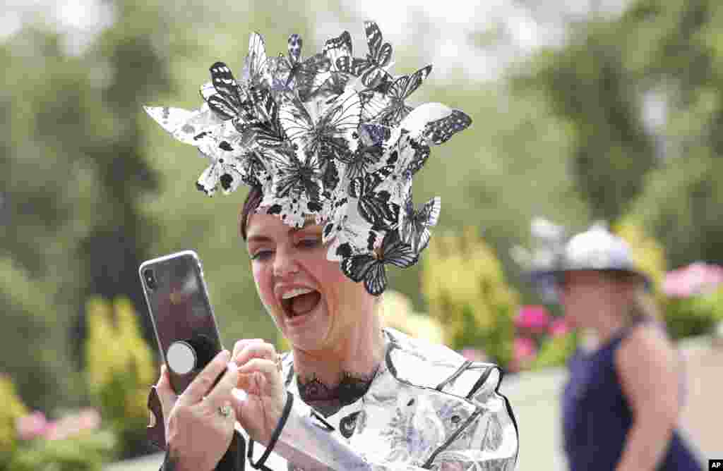 A racegoer reacts as she arrives on the third day of the annual Royal Ascot horse race meeting, which is traditionally known as Ladies Day, in Ascot, England.