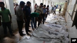 Bodies of victims are placed at a makeshift morgue at a hospital after a fire broke out at a factory in the Tongi industy area outside Dhaka, Bangladesh, Sept. 10, 2016.