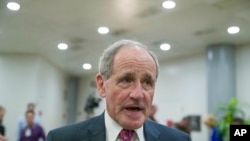 FILE - Senate Foreign Relations Committee Chairman Jim Risch, R-Idaho, speaks with the media after a closed-door briefing for the members of the Senate Foreign Relations Committee, March 5, 2019, in Washington. 