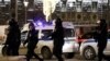 Police officers are seen near the Federal Security Service building after a shooting, in Moscow, Russia, Dec. 19, 2019. 