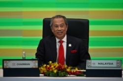 Malaysia's Prime Minister Muhyiddin Yassin takes part in the online Asia-Pacific Economic Cooperation leaders' summit in Kuala Lumpur, Nov. 20, 2020.