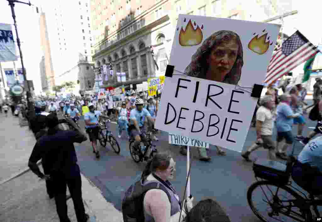 A supporters of Sen. Bernie Sanders, I-Vt., holds up a sign calling for Debbie Wasserman Schultz, chairwoman of the Democratic National Committee to be fired, in Philadelphia, July 24, 2016.