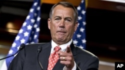 House Speaker John Boehner of Ohio gestures as he speaks to reporters after private talks with Treasury Secretary Timothy Geithner about the fiscal cliff negotiations, on Capitol Hill in Washington, November 29, 2012.