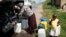 Residents of Ntuzuma collect water from a truck after cuts in water supply were made due to persistent drought conditions, in Durban, South Africa, Jan. 22, 2017.