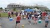 US Team fans kick around soccer ball before the US-Germany game at RFK stadium in Washington, D.C., June 2, 2013. (Photo: Parke Brewer / VOA)