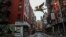 A street in New York's Chinatown is empty, the result of citywide restrictions calling for people to stay indoors and maintain social distancing in an effort to curb the spread of COVID-19, March 28, 2020, in New York.