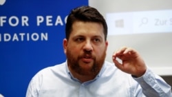 FILE - Leonid Volkov, an ally of Russian opposition politician Alexey Navalny, speaks during a news conference in Berlin, Germany, Aug. 21, 2020.