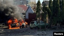 A car burns at the site of a Russian missile strike in Zaporizhzhia, Ukraine, on April 5, 2024. (Press service of the National Police of Ukraine via Reuters)