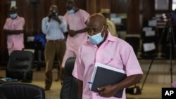 Paul Rusesabagina, who inspired the film "Hotel Rwanda" and is credited with saving more than 1,000 people by sheltering them at the hotel he managed during the genocide, attends a court hearing in Kigali, Rwanda, Feb. 26, 2021.