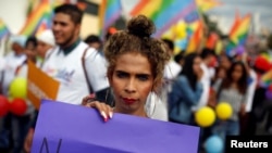 A participant holds a placard during a march to mark the International Day Against Homophobia, Transphobia and Biphobia in Tegucigalpa, Honduras, May 17, 2018. 