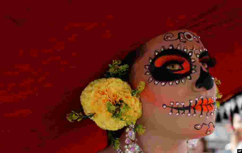 A reveler dressed as a Mexican &quot;catrina&quot; participates in the gay pride parade in Bogota, Colombia, June 30, 2019.