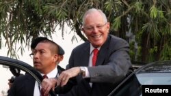 President Pedro Pablo Kuczynski leaves a meeting with opposition leader Keiko Fujimori in Lima, Peru, Dec. 19, 2016. 