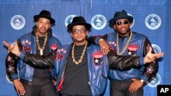 FILE—In this March 2, 1988 file photo the rap group Run DMC poses at the 31st annual Grammy Awards in New York City.