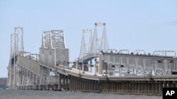 The Chesapeake Bay Bridge is seen from Stevensville, Md. Accessible only by plane or boat, Tangier Island in the Chesapeake Bay has reported zero cases of the coronavirus.