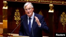 French Prime Minister Michel Barnier speaks during a censure motion debate filed by the alliance of left-wing parties, the New Popular Front, at the National Assembly in Paris, France, Oct. 8, 2024. 