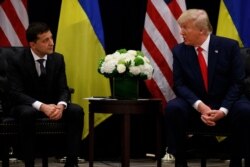 FILE - President Donald Trump meets with Ukrainian President Volodymyr Zelenskiy at the InterContinental New York Barclay hotel during the U.N. General Assembly, Sept. 25, 2019, in New York.